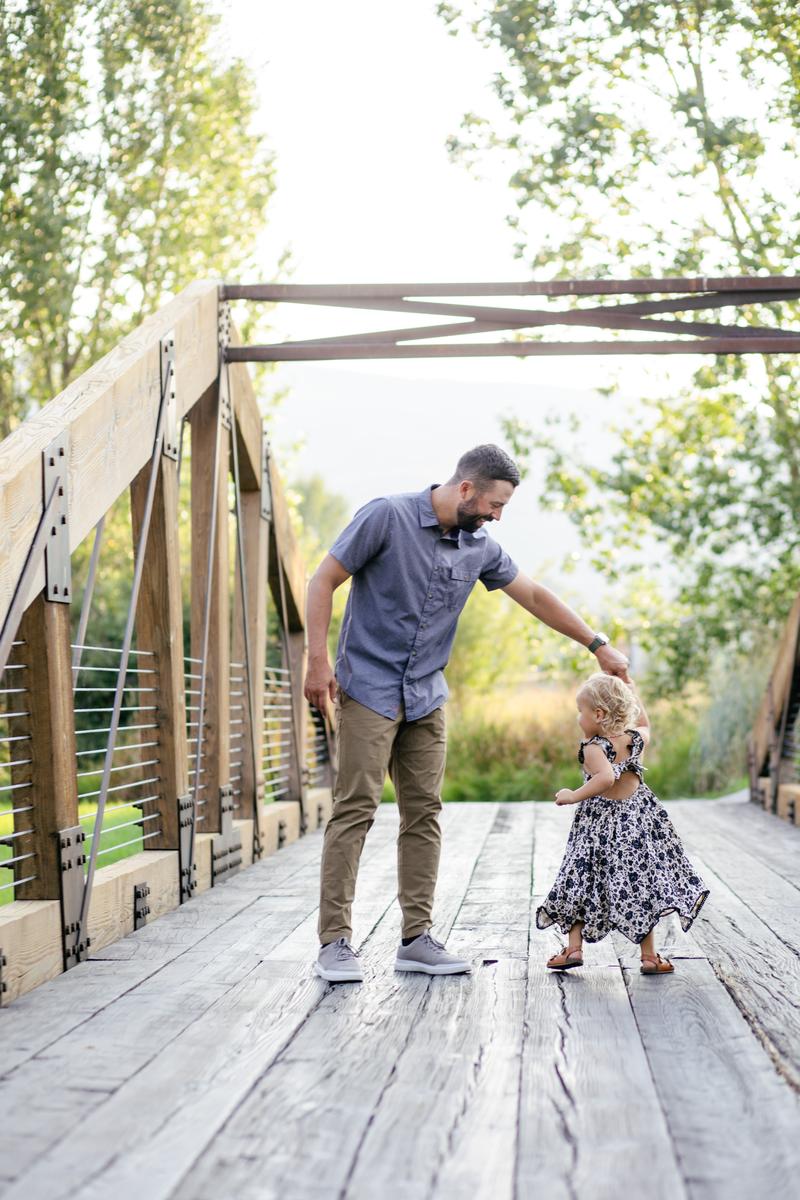 Nolan dancing with Emery on the bridge
