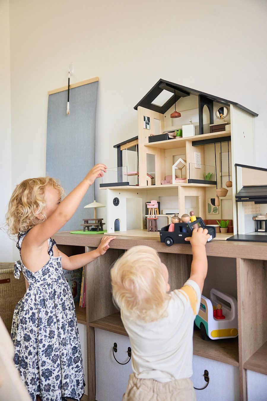 Emery and Ellison playing together at the Tiny Land Sweetwood Edge Modern Family Dollhouse