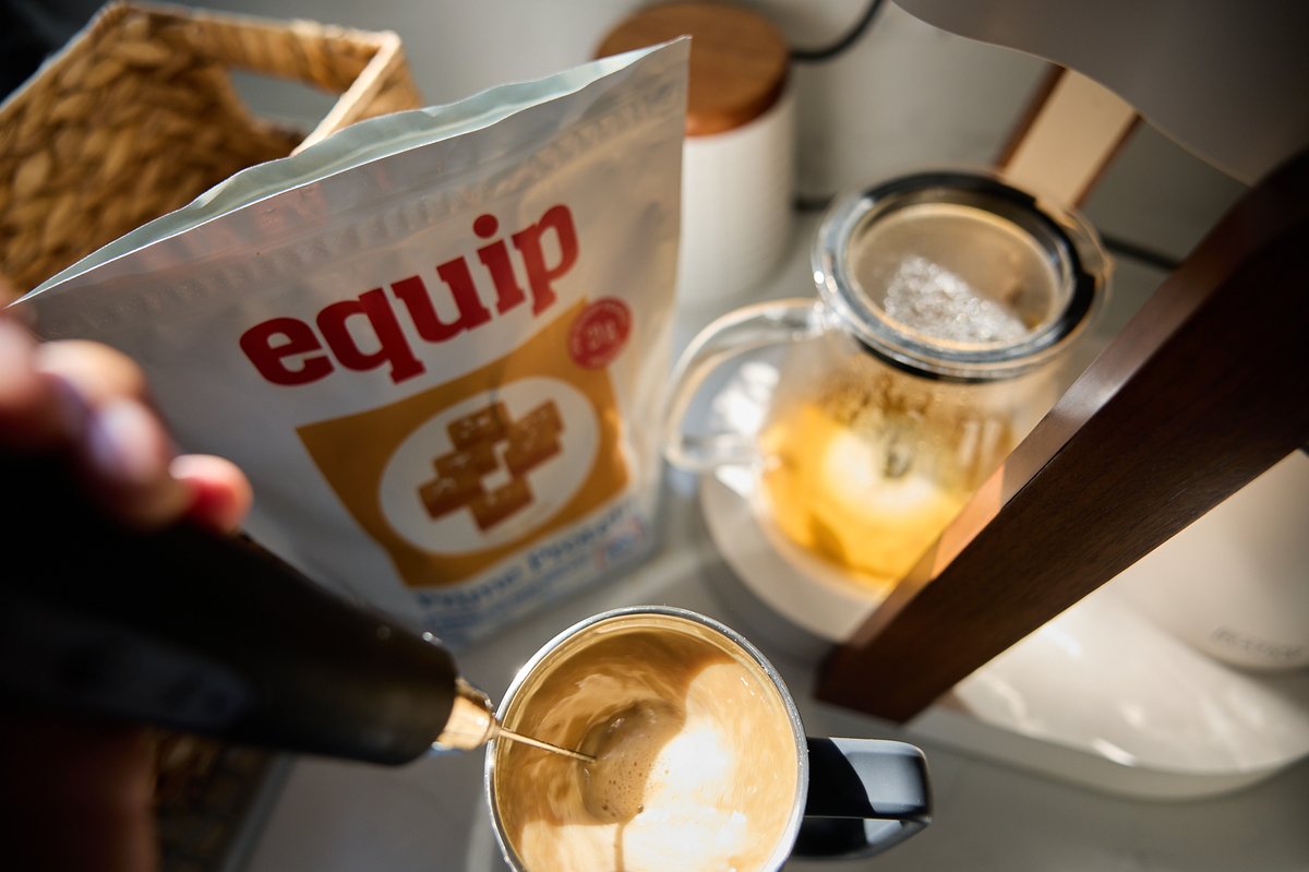 Equip Foods Prime Protein scooped into Nolan's post-workout coffee shake